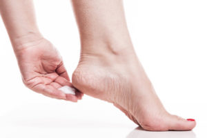 care for dry skin on the well-groomed feet and heels with creams